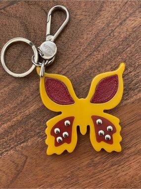 PRADA Yellow and Maroon Acrylic Butterfly Bag Charm